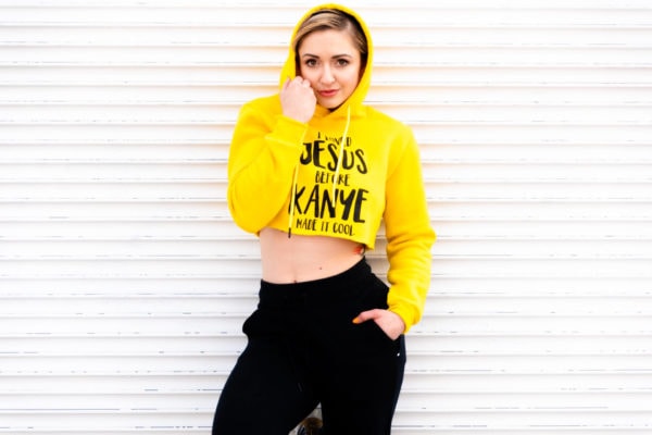 Anna Quinn wearing yellow cropped Modest Muscle hoodie