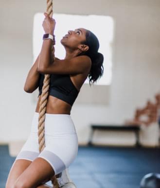 woman climbing rope